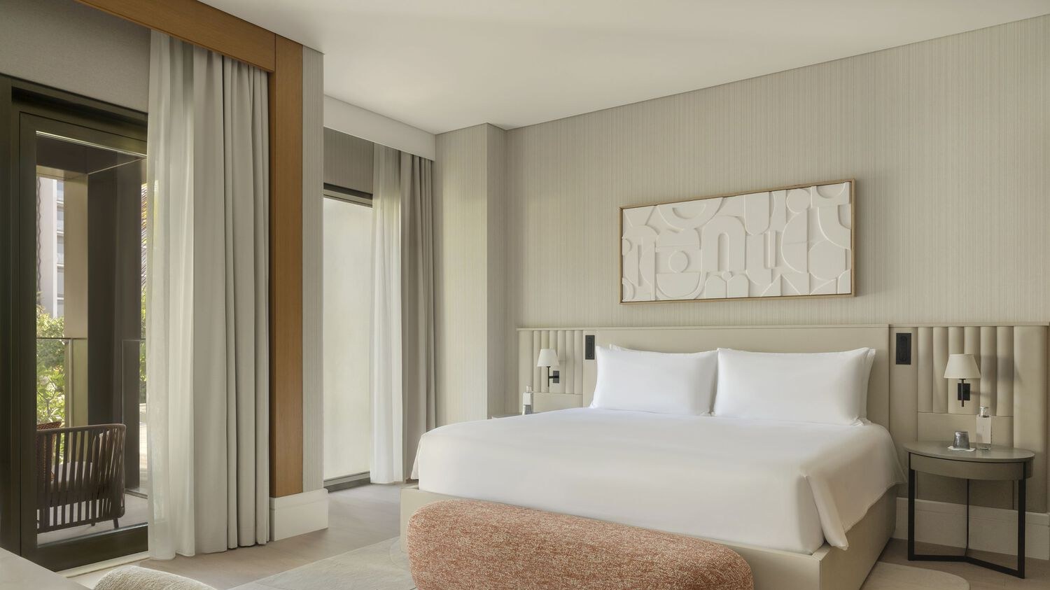 Project photograph of a coordinated high-rise hospitality guest room.